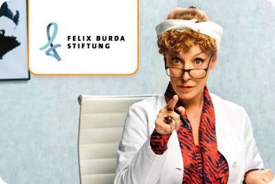 Actress Sissi Perlinger as a doctor urges colorectal cancer screening, next to her is the logo of the Felix Burda Foundation.